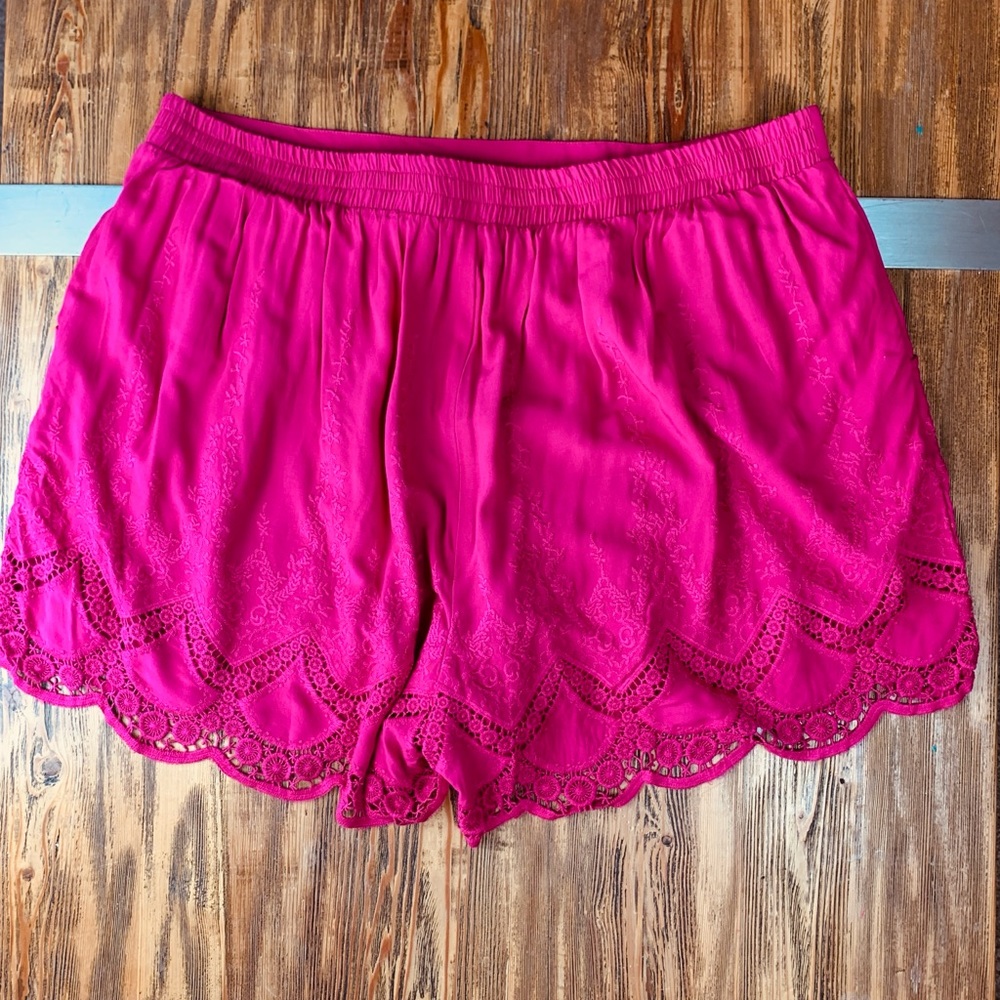 TORRID pink embroidered shorts.